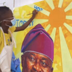 Seven-year-old Nigerian artist Kendis presenting his viral portrait