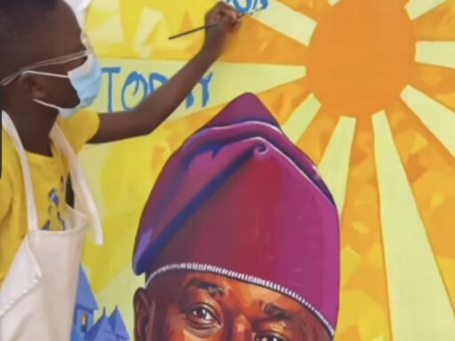 Seven-year-old Nigerian artist Kendis presenting his viral portrait